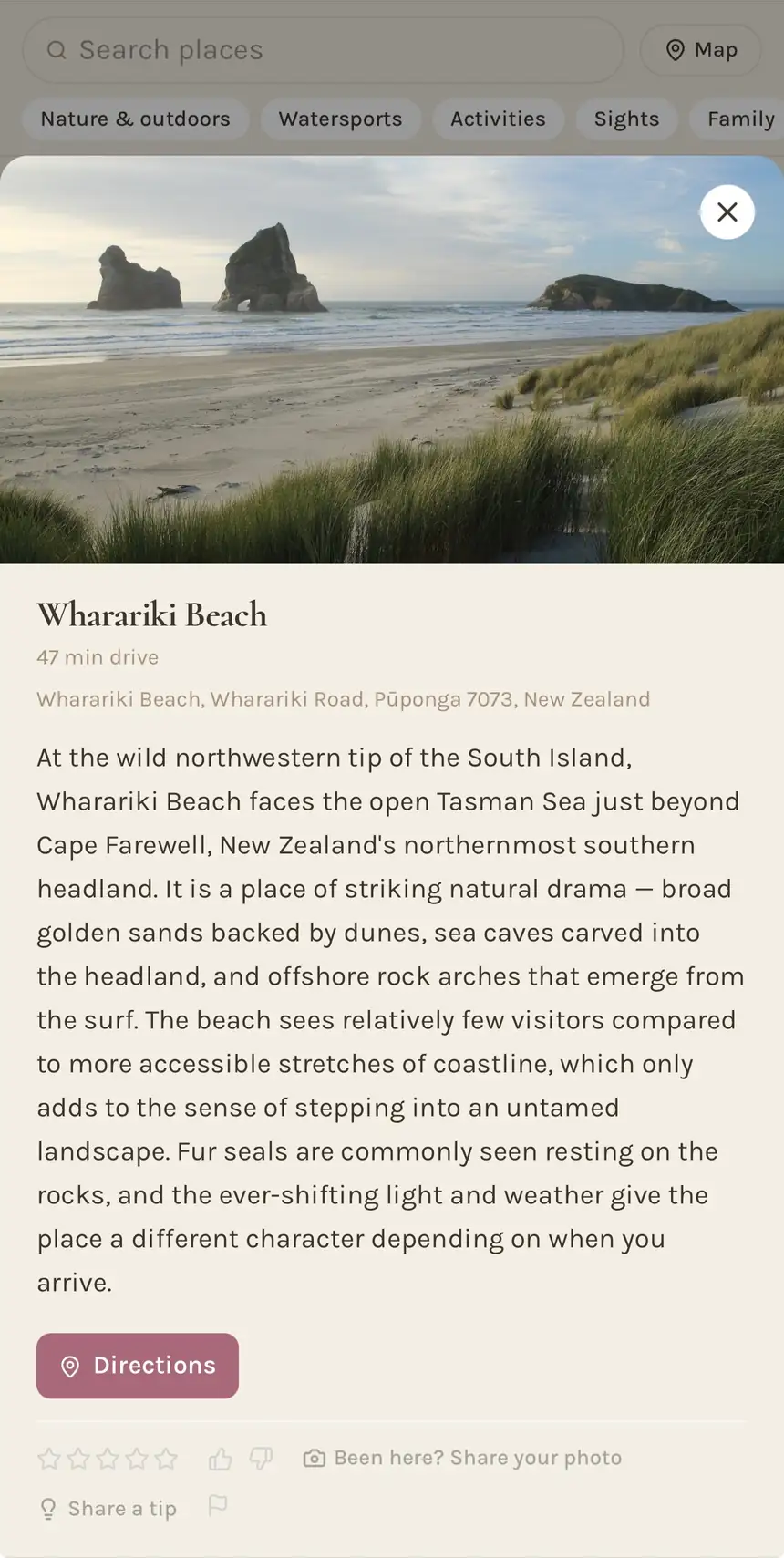 A guest guide place detail page showing Wharariki Beach with photos and description.